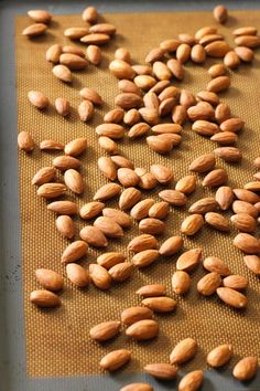 almonds on a baking sheet ready to go into the oven for roasting in the oven