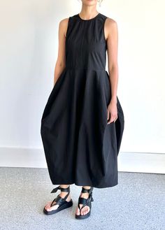 Relaxed style. Wide skirt. Oversized fit. One size  Slant hip pockets. Back zip closure. Lined 89% cotton, 11% polyester Product Measurements: Length 123cm / 48.45in.  Bust 88cm/34.6in. Waist 86cm/33.85in Chic Black Dresses With Slip Pockets, Chic Black Dress With Slip Pockets, Black Cotton Midi Dress With Pockets, Black Midi Dresses With Side Pockets, Chic Black Dress With Side Pockets, Casual Black Midi Dress With Pockets, Black Workwear Dress With Side Pockets, Black Midi Dress With Slip Pockets, Black Sleeveless Dress With Slip Pockets