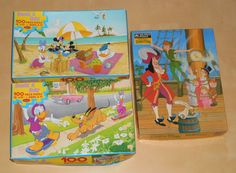 two children's puzzles are shown on the table next to each other, one with an image of mickey mouse and pluto