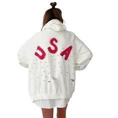 DESCRIPTION EACH PIECE IS MADE TO ORDER, HAND PAINTED BY GLORIA AND HER TEAM IN THEIR NYC STUDIO PRODUCT DESCRIPTION The perfect oversized white distressed hoodie. American flag painted on front chest, with USA painted on back in red, with blue outline. Signed @wrenandglory Due to each piece being hand painted, each piece might have slight differences. Limited edition. FIT Oversized, Super Comfy, Slouchy fit. Can be worn as a sweater or dress. One size fits most Measurements: Body Width 27", Len Distressed White Long Sleeve Top, White Distressed Sweatshirt, Sporty Long Sleeve Distressed Hoodie, White Distressed Long Sleeve Sweatshirt, Oversized Distressed Cotton Hoodie, Oversized Distressed Hoodie For Fall, Spring Distressed Long Sleeve Hoodie, White Distressed Casual Sweatshirt, Trendy Oversized Distressed Sweatshirt