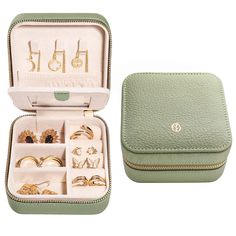 an open green case with jewelry in it on a white background and one opened to show the contents