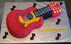 a sheet cake with a guitar on it