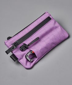 Rugged and compact, this clutch comes in weatherproof sailcloth fabric. Practical and functional, it allows you to keep your essentials always at hand.This clutch also comes with a detachable hand strap, so you can easily carry it when you need to. As a bonus, it comes with three external slots for additional space to carry a phone, pen, a small torch, etc. Sailcloth Fabric, Phone Pen, Diy Backpack, Notebook Ideas, Sailing Outfit, Edc Gear, Hand Strap, Best Bags, Inside Pocket