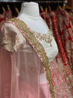 Dusky peach heavy kundan border lehenga with contrasting pearl white floral zardozi embroidery blouse and net border dupatta. Fabric: Raw Silk This outfit can be customized in multiple colors and specific to client measurements. 90 days of production time is required and are for bulk orders only! Orders are processed in store only! Final fittings/alterations not included. Minimum Order Quantity- 4 pieces Traditional Organza Lehenga With Gota Work, Peach Lehenga With Traditional Drape For Reception, Traditional Drape Peach Lehenga For Reception, Designer Peach Dupatta With Gota Work, Pink Organza Choli With Gota Work, Peach Anarkali Set With Traditional Drape For Wedding, Peach Choli With Sheer Dupatta For Weddings, Peach Sharara For Wedding, Peach Wedding Sets With Sheer Dupatta