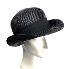 Bowler straw hat made in 8/9 milimeters black straw braid. Adorned with an excellent 50 millimeters wide black grosgrain ribbon and finished with a bow to the right of the hat. Custom hat options: 1- You can choose between a grosgrain ribbon inside or a genuine leather inner band. 2- I usually wear a black grosgrain ribbon as a hat trim, but if you want you can choose your favorite color from my grosgrain color chart. Just write a brief note when you place the order. The price is the same. For i Classic Wide Brim Top Hat For Spring, Classic Black Panama Hat, Classic Adjustable Brimmed Cloche Hat, Classic Wide Brim Top Hat For The Beach, Classic Cloche Hat With Adjustable Short Brim, Classic Brimmed Top Hat For Spring, Classic Adjustable Cloche Hat With Short Brim, Classic Black Straw Hat With Curved Brim, Classic Black Boater Hat With Curved Brim