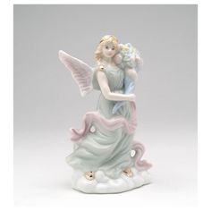 an angel figurine holding a baby in her arms