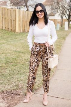 work outfit for fall and winter - white sweater, brown belt, leopard pants, nude pump, Tory Burch fleming crossbody bag, Tiffany & Co. sunglasses. Head on to www.OneAwesomeMomma.com for more winter outfits like this. #winterstyle #winterfashion #momstyle