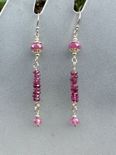 Beautiful pink gemstones wire wrapped in 14k gold filled wire. Earrings measure 2 1/5 inches long. Gold filled ear wires. Beautiful gold filled bead caps envelope large pink sapphires, uniquely wrapped pink tourmaline gemstones, finished with smaller pink sapphires. Barbie summer! Lots of lovely pinks. Pink 14k Gold-filled Wire Wrapped Earrings, Pink Dangle Earrings, Barbie Summer, Wire Jewelry Making, Bijoux Fil Aluminium, Beaded Earrings Tutorials, Diy Jewelry Unique, Jewellery Sketches, Earrings Wire