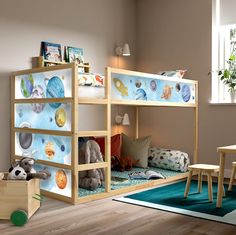 a child's bedroom with bunk beds and toys