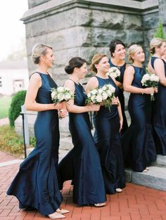 a group of women standing next to each other