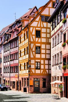 an old building with half - timbered walls in the city