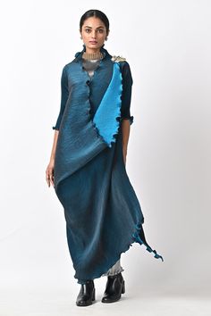 Midnight blue wrap dress with hand embroidery, key detailing and pleats.
Components: 1
Pattern: Hand embroidery
Neckline: V Neck
Sleeve Type: Three quarter
Fabric: Pleated polyester mix
Color: Blue
Other Details: 
Note : Inner and belt worn by the model are not for sale.
Occasion: Party - Aza Fashions Kiran Uttam Ghosh, Embroidery Neckline, Blue Wrap Dress, Printed Wrap Dresses, Fashion App, Mix Color, Dress For Women, Aza Fashion, Abstract Print