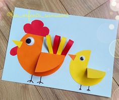 an origami chicken and chick on a card