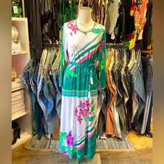 D E S C R I P T I O N Stunning Vintage 1970s Jersey Stretch Short Sleeve Maxi Dress With Floral Print. S I Z E & M E A S U R E M E N T S Measurements Taken Across While Garment Laying Flat And Unstretched. Double Measurement To Get The All Around. Length: 55" Chest: 15" Hips: 17” Waist: 15" Sleeve Length: 21" Shoulders: 15” Fits As Size Small Authenticity Guarantee All Items Sold In Our Shop Are 100% Guaranteed Authentic Vintage Or Your Money Back. White Retro Beach Dress, Retro White Beach Dress, Retro Spring Vacation Maxi Dress, Retro Midi Dress For Spring Day Out, Retro Spring Maxi Dress, Spring Retro Maxi Dress, Retro Green Midi Dress For Spring, 1970s Style White Maxi Dress, White Vintage Midi Dress For Day Out