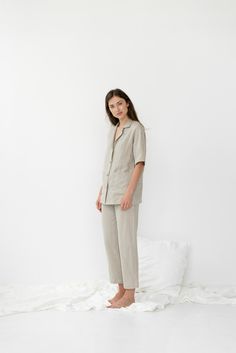 "When ordering you can choose to have the \"PANTS\" or \"TOP\" only or the whole \"PAJAMA SET\" of both items. When buying a set you save 5 euro. Relaxed fit EVA pajama pants with pockets and ALEXIS short sleeve shirt. TOP: - length is ± 72 cm (28\") (depends on size) - coconut buttons closure - short sleeves - with pockets BOTTOM: - outseam is ± 98 cm (38.5\") (depends on size) - inseam is ± 70 cm (27.5\") - elastic waistband with fabric strap - two side pockets DETAILS: - 100 % European, pre-w Relaxed Fit Sleepwear With Buttons For Loungewear, Spring Sleepwear Sets With Short Sleeves, Casual Sleep Sets With Buttons, Casual Sleepwear Sets With Buttons, Spring Short Sleeve Sleepwear For Home, Relaxed Fit Sleepwear With Buttons, Spring Sleepwear With Short Sleeves For Home, Short Sleeve Sleepwear With Buttons, Relaxed Fit Short Sleeve Sleepwear