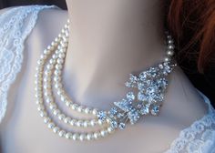 Bridal Rhinestone Necklace, Ivory Swarovski Pearls, Statement Bridal Necklace, Pearl Rhinestone Necklace,Bridal Pearl Necklace, DARCIE. $115.00, via Etsy. White Bridal Necklace With Bling For Wedding, White Bling Bridal Necklace For Wedding, White Bling Necklace For Wedding, White Bling Necklaces For Wedding, Crystal Pearl Necklace With Rhinestones For Wedding, White Pearl Rhinestone Necklace For Wedding, Elegant Pearl Rhinestone Necklace, Multi-strand Pearl Necklace For Wedding, Multi-strand Pearl Pendant Necklace For Wedding