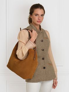 Our stylish and spacious shoulder bag, the Tetbury is part of a much-loved family. With a slouchy silhouette, and a range of carefully-considered style touches, it feels relaxed yet refined. Wear slung over your shoulder for days out or the office. Handcrafted in Spain, from soft sustainably sourced materials, we’ve added touches like the braided over-shoulder handle, and understated branding detail, such as shiny light gold shield hardware and an embossed logo. The microfibre-lined large compar Timeless Shoulder Bag For Travel In Fall, Luxury Brown Hobo Bag For Everyday, Timeless Everyday Satchel Shoulder Bag, Leather Handles Hobo Shoulder Bag For Work, Luxury Cognac Shoulder Bag For Everyday, Timeless Cognac Shoulder Bag For Everyday, Classic Everyday Hobo Shoulder Bag, Timeless Fall Bag For Everyday Use, Classic Hobo Shoulder Bag For Everyday