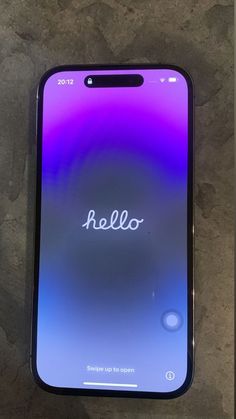 an iphone with the word hello written on it's back side, sitting on a table