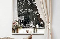 the window is decorated with christmas decorations