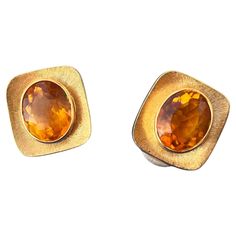 A beautiful pair of Citrine earrings designed by Burle Marx. The 4 carat faceted oval citrine displays a tangerine yellow hue, bezel set in an 18 karat yellow gold abstract design earrings. The backs of the earrings are signed "Burle Marx” and stamped "18K Brazil”. A designer, lapidary and gemologist, Haroldo ran a successful workshop in Rio from the 1930s through the 1980s. His exceptional work was a source of pride for the nation. When dignitaries visited Brazil, the government often commissioned Haroldo to create pieces to present to them. Japan’s Empress Nagako, for one example, received an opal necklace when she visited the country. Queen Margrethe of Denmark wore a Burle Marx demi suite of an aquamarine ring and brooch on her wedding trip in 1966. Other luminaries who had at least on Modern Oval Hallmarked Earrings, Formal Orange Oval Cabochon Jewelry, Orange Oval Cabochon Jewelry For Formal Occasions, Modern Oval Clip-on Jewelry, Modern Gold Cabochon Earrings, Modern Yellow Earrings For Formal Occasions, Modern Orange Oval Jewelry, Classic Orange Earrings For Formal Occasions, Formal Oval Faceted Earrings