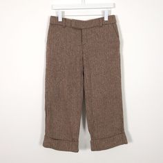 "Y2K Low Rise Herringbone Wool Blend Cropped Pants Brown Classic herringbone pattern Cuffed hem Cropped length Low rise Zip, button & hook closure Front & back pockets Shell: 60% wool, 40% rayon Lining: 100% polyester Brand: Old Navy Gently used condition, no flaws Size 6 See measurements to confirm fit Laying flat 15\" waist 18.5\" hip 8.5\" rise 22.5\" inseam 8.5\" leg width at bottom Measurements are approximate" Fitted Bottoms With Herringbone Pattern For Winter, Fitted Herringbone Bottoms For Winter, Fitted Herringbone Pattern Bottoms For Winter, Winter Herringbone Pattern Pants For Work, Tailored Herringbone Bottoms For Workwear, Herringbone Pattern Trousers For Fall, Fall Herringbone Trousers, Tailored Bottoms With Pockets For Winter, Tailored Winter Bottoms With Pockets