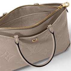 LOUIS VUITTON® - Trianon Mm - Turtledove Sac Louis Vuitton, Louis Vuitton Sac, Louis Vuitton Official, Monogrammed Leather, The Grey, Leather Top, Cowhide Leather, Tote Handbags