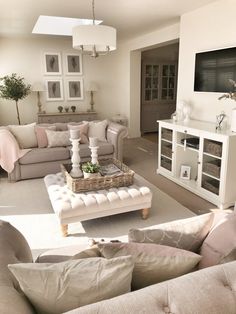 a living room filled with furniture and a flat screen tv mounted to the side of a wall