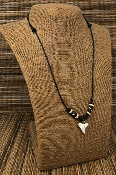 "Shark teeth necklace Adjustable Shark Tooth Unisex Necklace Handmade Necklace. Adjustable cord with sliding knots from 15\" Inches up to 30 Inches Around the Neck. Adjustable Cord - Fits Most Size. Use this necklace short or long. Pull the knots to adjust the length. This beautiful necklace is simply stunning. Our commitment to excellent quality ensures each piece is skillfully inspected.Order this today or browse our incredible selection of jewelry. FAST SHIPPING! To visit my Etsy Shop: https: Black Casual Necklace With Adjustable Cord, Casual Black Necklace With Adjustable Cord, Casual Black Pendant Jewelry, White Necklace With Adjustable Waxed Cord, Casual Adjustable Necklaces With Sliding Knot, Casual Adjustable Necklace With Sliding Knot, Black Casual Jewelry With Adjustable Chain, Casual Black Jewelry With Adjustable Chain, Adjustable Pendant Jewelry With Waxed Cord