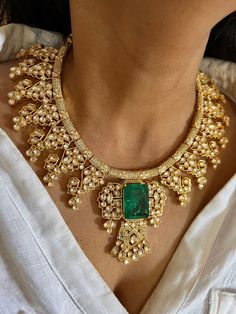 Discover the epitome of elegance with our premium necklace set. Crafted with precision and designed to turn heads, this set is a true masterpiece. Product Details: Material: Each piece is meticulously handcrafted from high-quality brass, copper, CZ Stones, Kundan work, Green stones. Necklace Dimensions: Weight: 138 grams It's a collar necklace. Closure Type: Premium Dori Adjustable Size: Yes Earring Dimensions (Per Pair): Weight: 34 grams Length: 7 cm Width: 3.5 cm Closure Type: Push Back Closure with Extra Support Clip at the Back. Exquisite Design: This set boasts a design that's truly captivating, ensuring you stand out on any occasion. Compliment Magnet: Expect a shower of compliments every time you wear this stunning ensemble. Indulge in the finest craftsmanship with our brass necklac Necklace Closure, Kundan Work, Stones Necklace, Indian Jewelry Sets, Green Stones, Elegant Necklace, Brass Necklace, Wedding Jewellery, Elegant Necklaces