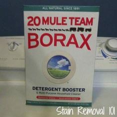 a box of borax sitting on top of a washer dryer machine