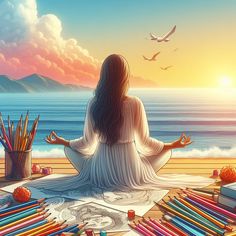 a woman meditating on the beach in front of some books and crayons