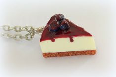 a piece of cheesecake is sitting on a chain