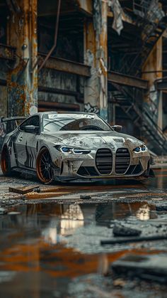 a white sports car parked in front of a building with rust on it's sides