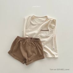 Description: This is a two-piece cozy, comfy sleeveless top with pocket and matching short set. The shorts have an elastic waistband. This set is perfect for the summer months! Size: 2T 3T 4T 5 6 7 8 9 Care Instructions: Machine wash cold, gentle cycle, hang dry for best results or tumble dry low. 100% Cotton REMINDER: For Child's safety, garment should fit snugly. Cute Cotton Sets With Pockets, Casual Sleeveless Loungewear Sets, Cute Solid Color Sleeveless Sets, Cute Sleeveless Solid Color Sets, Beige Playwear Sets For Summer, Summer Beige Playwear Sets, Solid Cotton Sets With Pockets, Casual Beige Playwear Sets, Casual Cotton Short Set For Playwear