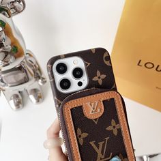 someone is holding their louis vuitton phone case in front of the camera lens