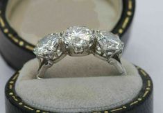 three stone diamond ring in its presentation box