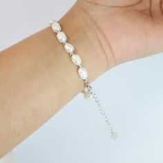 This romantic FRESHWATER PEARL Bracelet is made of a very fine quality of  Fresh Water pearls and 925 sterling silver for your special days! Freshwater pearls are real, cultured pearls, grown in lakes, rivers, as well as ponds. Most Freshwater pearls are white and resemble Akoya pearls, but they also produce a variety of pastel shades, including pink, lilac and peach. Measurements:- This Bracelet is 9 inches (adjustable) around your hand. ► ABOUT YOUR ORDER * All items are neatly packaged in our beautiful jewelry boxes and elegant organza bags. * All items are 100% gift-ready. * Each order comes with a personalized handwritten card and a branded Millennium Bride jewelry cloth. * Each order comes with a free gift. ► PERSONALIZTION * If your order is a gift, you may contact us with the recip Minimalist Adjustable Pearl Bracelet For Anniversary, Minimalist Sterling Silver Pearl Bracelet For Wedding, Delicate Beaded Bracelet For Anniversary, Adjustable Hypoallergenic Pearl Bracelet For Anniversary, Adjustable Sterling Silver Pearl Drop Bracelet, Delicate Sterling Silver Pearl Bracelet As Gift, Pearl White Bracelet With Sterling Silver Clasp As Gift, Classic Adjustable Pearl Bracelet For Anniversary, Adjustable Classic Pearl Bracelet For Anniversary