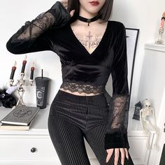 Looking for a dark and edgy goth-inspired crop top? our lace patchwork dark goth v neck long sleeve crop top will give you that perfect blend of edgy and feminine vibes. the intricate lace patchwork and deep v-neckline add a touch of elegance to this otherwise simple top. it's perfect for pairing with high-waisted pants or skirts for a sleek, fashion-forward look. don't miss out on this must-have wardrobe staple - shop now! Long Sleeve Lace Crop Top, Goth Long Sleeve, Gothic Blouse, Low Cut Blouses, Festival Mode, Bell Sleeve Crop Top, Gothic Shirts, Flare Long Sleeve, Corset Crop Top