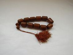 "Vintage folk Greek big handmade wooden decorative worry beads \" koboloi\" Good vintage condition. Full Length with cord 30 cm. All my packages are registered and you will be olso receiving tracking number. Please ask if you have any questions. Visit our shop for more colector's items. https://www.etsy.com/shop/prestigiousantiques?ref=hdr" Brown Wooden Beads For Festivals, Traditional Wooden Beads For Festivals, Traditional Beaded Brown Rosary, Traditional Brown Beaded Rosary, Traditional Brown Rosary With Round Beads, Traditional Hand-strung Brown Beads, Traditional Large Brown Beads, Traditional Brown Large Beads, Traditional Brown Beads For Rituals