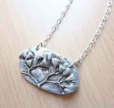 Flowering Sage Pendant, Precious Metal Clay, Fine Silver, Botanical Necklace, Flower Jewelry, Organic Nature, .999 Silver, Sterling Chain This pendant is hand-crafted from a mold of an actual sprig of sage flowers that are pressed into fine silver clay, formed into shape, and fired in a kiln at 1650 degrees. Once fired, it is polished and then oxidized to bring out the beautiful 3-dimensional plant details. The result is a stunning and versatile pendant that works as well with a t-shirt and jeans as it does with a special dress. Sage is often mentioned as the herb of immortality, domestic virtue, health, and wisdom. Sage was a sacred ceremonial herb of the Romans. It has been cultivated for both culinary and medicinal purposes for many centuries in Europe. Derived from the Latin word salus Silver Brass Jewelry With Flower Pendant, Metal Clay Pendants Ideas, Silver Clay Pendant, Pmc Jewelry Metal Clay Silver Pendants, Handmade Sterling Silver Botanical Necklace, Sage Flowers, Botanical Necklace, Dress Sage, Special Dress