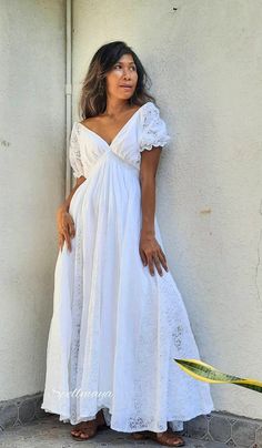 Handmade bohemian v neck maxi dress with floor length full circle skirt. There is the lace between a skirt with lining inside. Puffy lace sleeves. Elastic waist. 100% soft Cotton. There is 2 colors White and Off White. NOTE: Dress TK off white with white lace. waist 21 up to 45 inches. Dress SP off white with cream lace. waist 22 up to 46 inches. Dress E1 off white with white lace. White color lace FV with white lace. PLEASE LEAVE YOUR PHONE NO. AND EMAIL ADDRESS. Measurements: Bust up to 46 in Bohemian V-neck Maxi Dress For Beach Wedding, Flowy Maxi-length Maternity Dress For Beach, Flowy Maternity Maxi Dress For Beach, Flowy Maxi Maternity Dress For The Beach, Flowy Maxi Length Maternity Dress For The Beach, Maternity Lace Trim Maxi Dress, Chic Empire Waist Wedding Maxi Dress, Maternity Maxi Dress With Lace Trim, Maternity Lace Maxi Dress