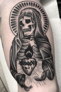 a black and white tattoo with a skeleton holding a heart