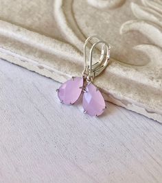 Rose Quartz Earrings, Pink Teardrop Earrings, Blush Pink Earrings, Small Dangle Earrings, Rose Quartz Gold Jewelry, Gift for Mom, Girlfriend These small but gorgeous earrings feature soft pastel pink rose quartz faceted teardrops bezel framed in gold filled. The teardrops are suspended from gold filled lever back ear wires. These are understated, delicate and dainty earrings but with a gorgeous soft and neutral color sure to match many outfits. Ideal for a girl or a women that likes light weight Pink Hypoallergenic Teardrop Earrings, Dangle Teardrop Earrings As Bridesmaid Gift, Dangle Teardrop Earrings For Bridesmaids, Teardrop Drop Earrings For Bridesmaids, Pink Drop Earrings With French Hook, Elegant Pink Nickel-free Teardrop Earrings, Blush Pink Earrings, Rose Quartz Properties, Small Dangle Earrings