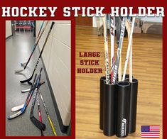 hockey stick holders are lined up against the wall and on the floor, along with other sports equipment