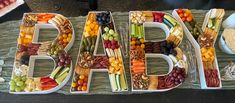 the letters are made out of fruits and veggies to spell dad's day