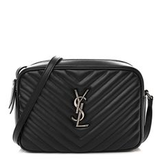 This is an authentic SAINT LAURENT Calfskin Matelasse Monogram Lou Camera Bag in Black. This chic shoulder bag is crafted of chevron-quilted calfskin leather in black. The bag features a leather shoulder strap, a ruthenium YSL logo, and ruthenium hardware. The top zipper opens to a compact black fabric interior with a pocket. Ysl Logo, Black Fabric, Camera Bag, Calf Skin, Saint Laurent, Shoulder Strap, Monogram, Shoulder Bag, Zipper