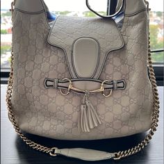 Gucci Emily Guccissima Leather Hobo Bag, White (Bone Color) Used Gucci Bag Kept In Good Condition. Authentic With Serial Number Shown In Pictures. Bone Color With Gold Hardware. Hardware Is Not Scratched Looks Shiny And Clear. Leather Outside Is Clean Without Stains (Had Cleaned A Little While Back). Inside Of The Bag Could Use Another Cleaning Has Everyday Stains/Signs Of Wear. Also Signs Of Wear On Straps But Not Super Visible In Person Or When Using. Gucci Handbag, Bone Color, Leather Hobo Bag, Gucci Handbags, Gucci Bags, Leather Hobo, Hobo Bag, Gucci Bag, Gold Hardware