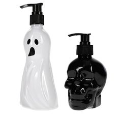 two black and white soap dispensers next to each other on a white background