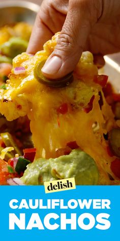 someone is dipping some guacamole on top of the casserole dish