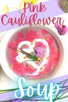 pink cauliflower soup in a white bowl with the words, pink cauliflower soup